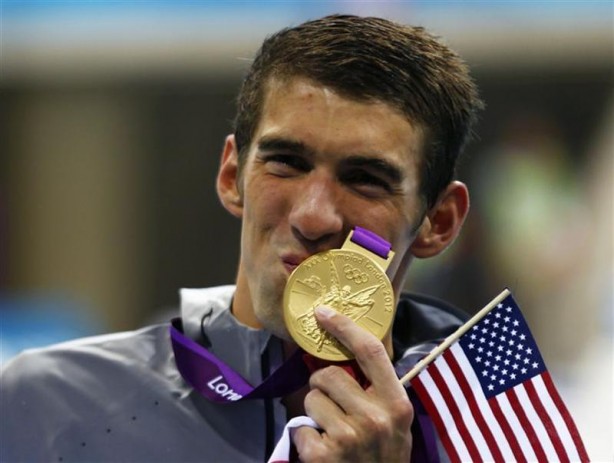 michael-phelps-of-the-u-s-kisses-his-19th-olympic-medal-presented-to-him-in-the-mens-4x200m-freestyle-relay-victory-ceremony-during-the-london-2012-olympic-games-at-the-aquatics-centre-july-31-2012.jpg?w=614